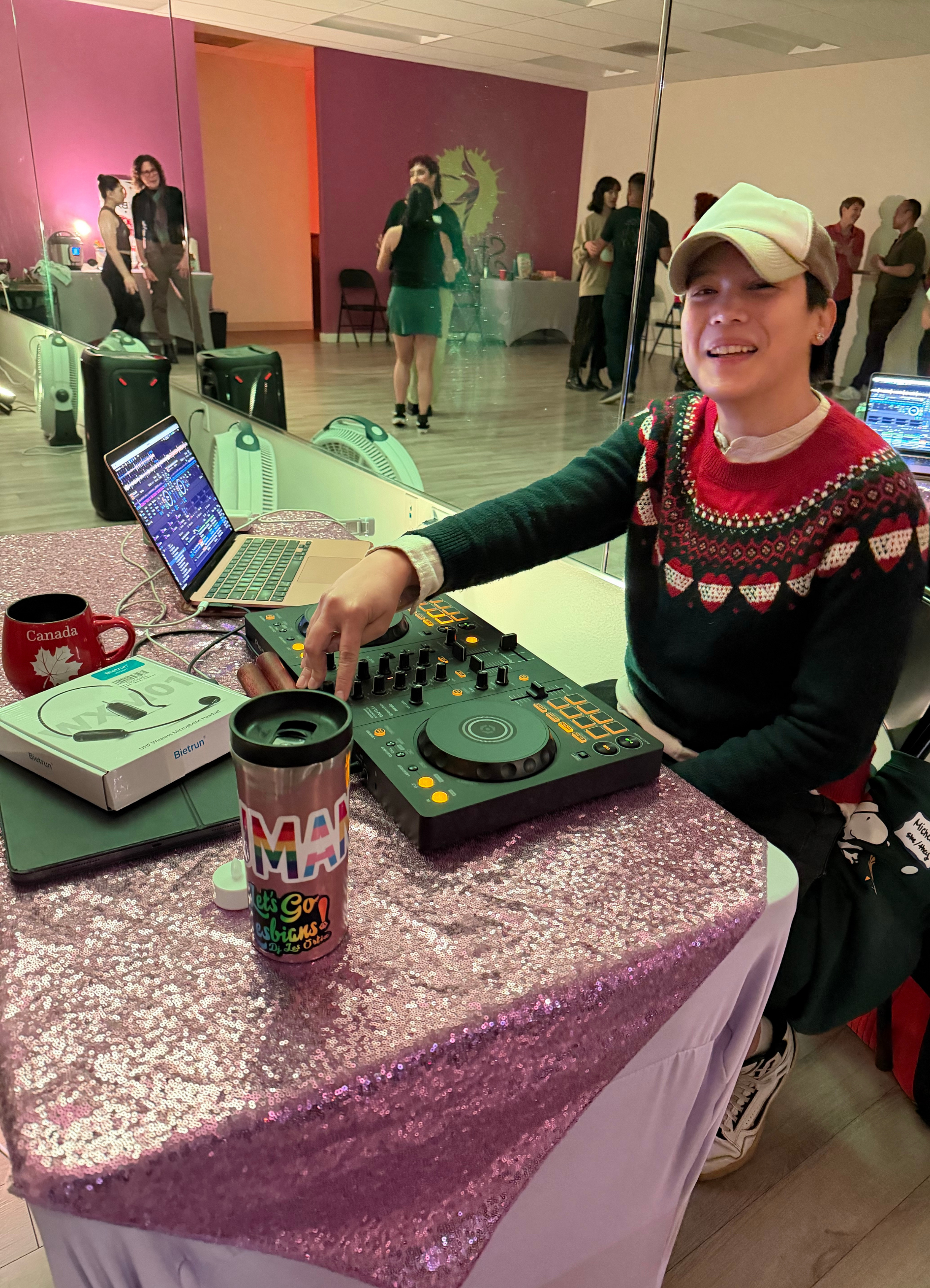Couple dancing salsa together at a community event, smiling and having fun